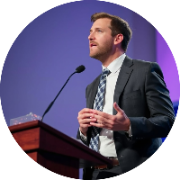 Man preacher in a suit and tie delivering an inspiring sermon.